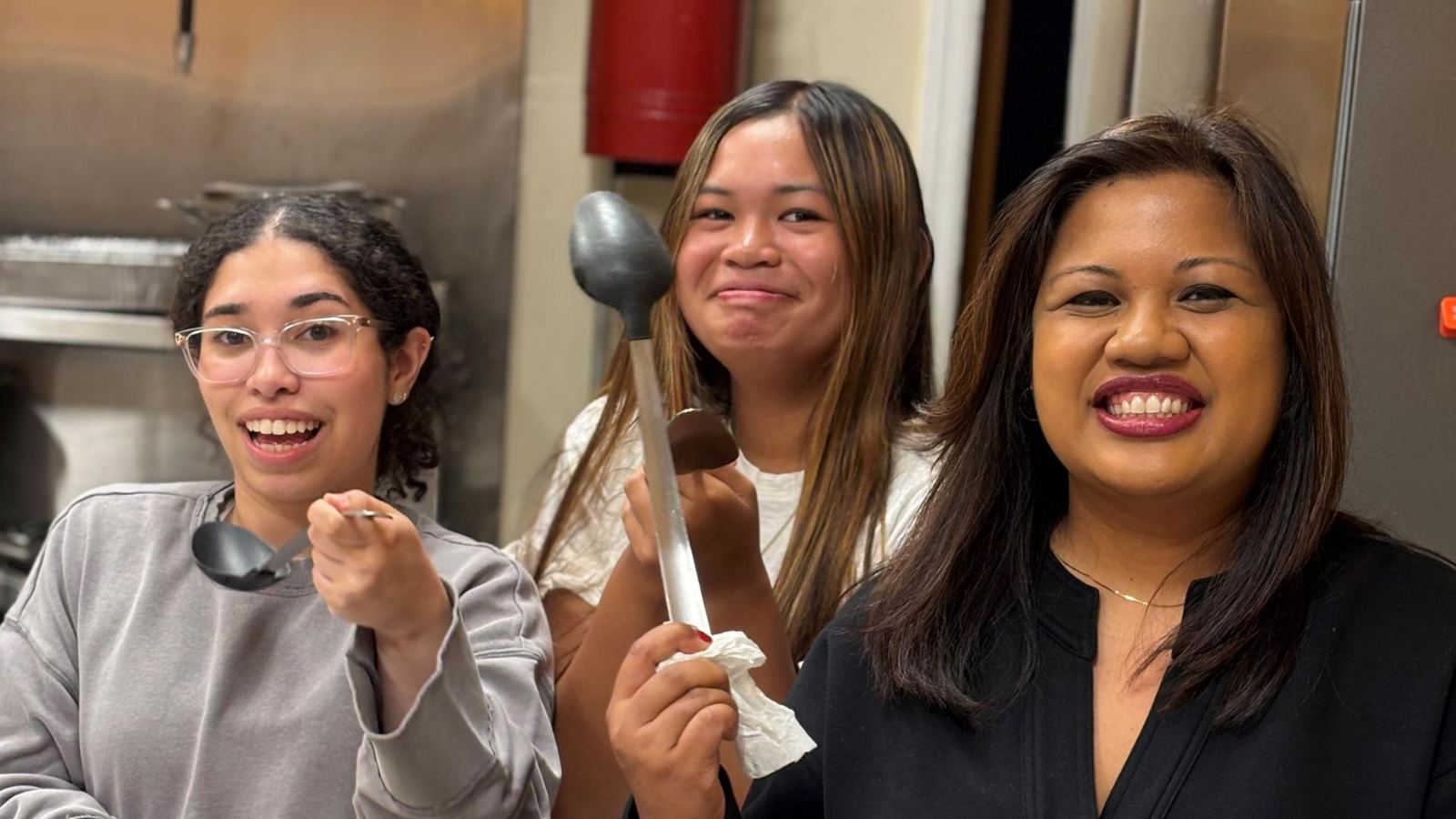 Volunteers serving in the church kitchen