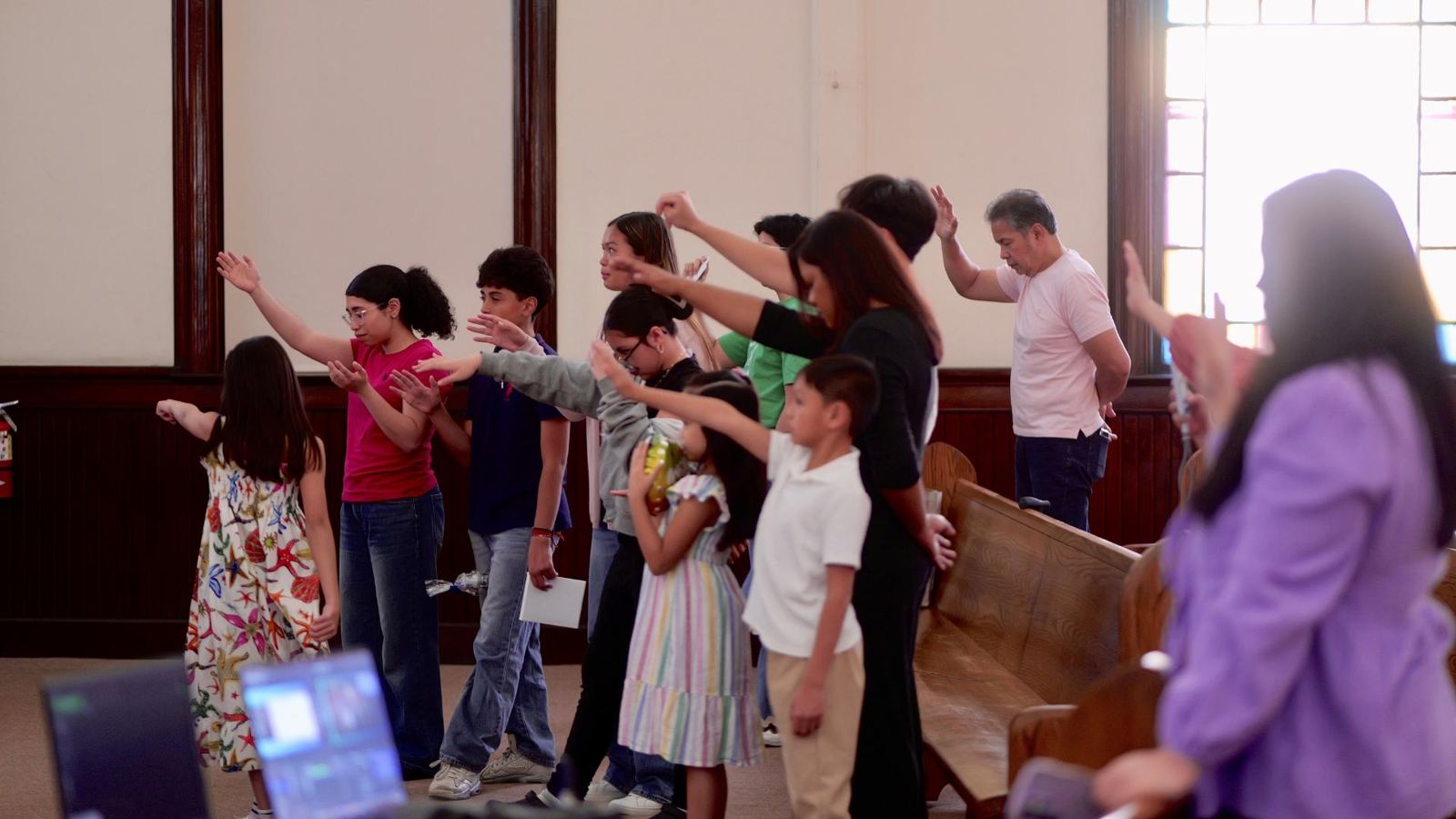 Kids and adults worshiping together